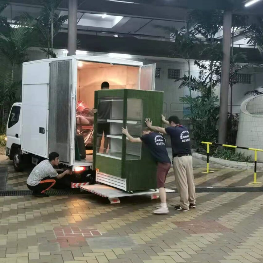 Move Move Movers team carrying a large household fridge in Singapore
