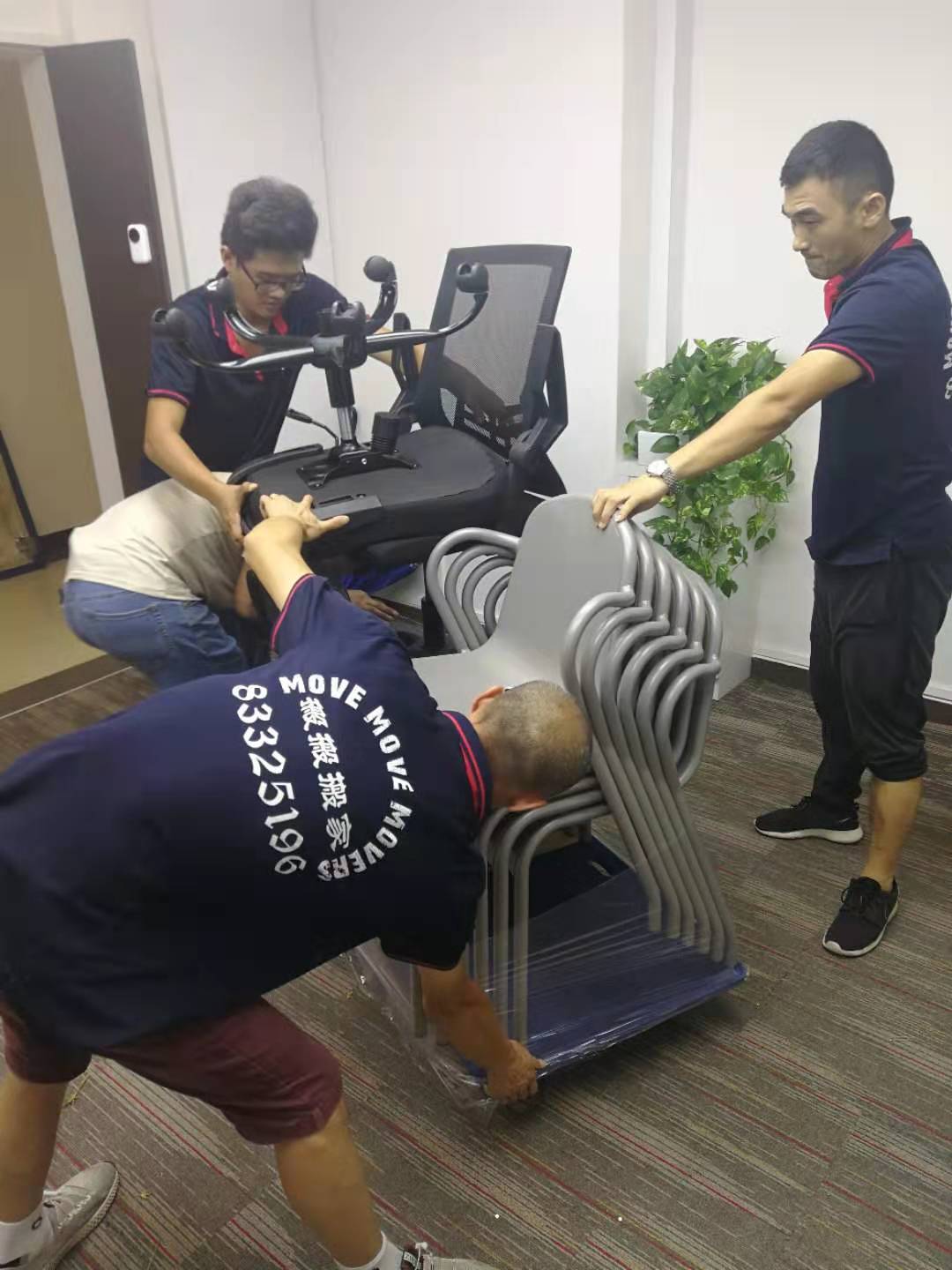 Office chairs and loose furniture being grouped for removal in Singapore