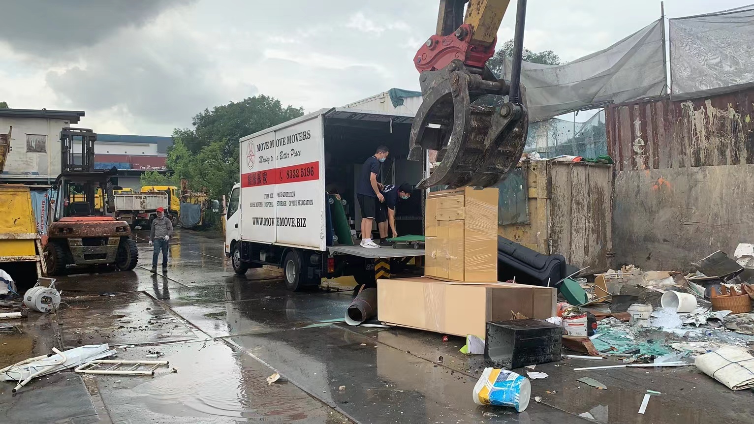 Skip tank and item-sorting setup for a private disposal job in Singapore