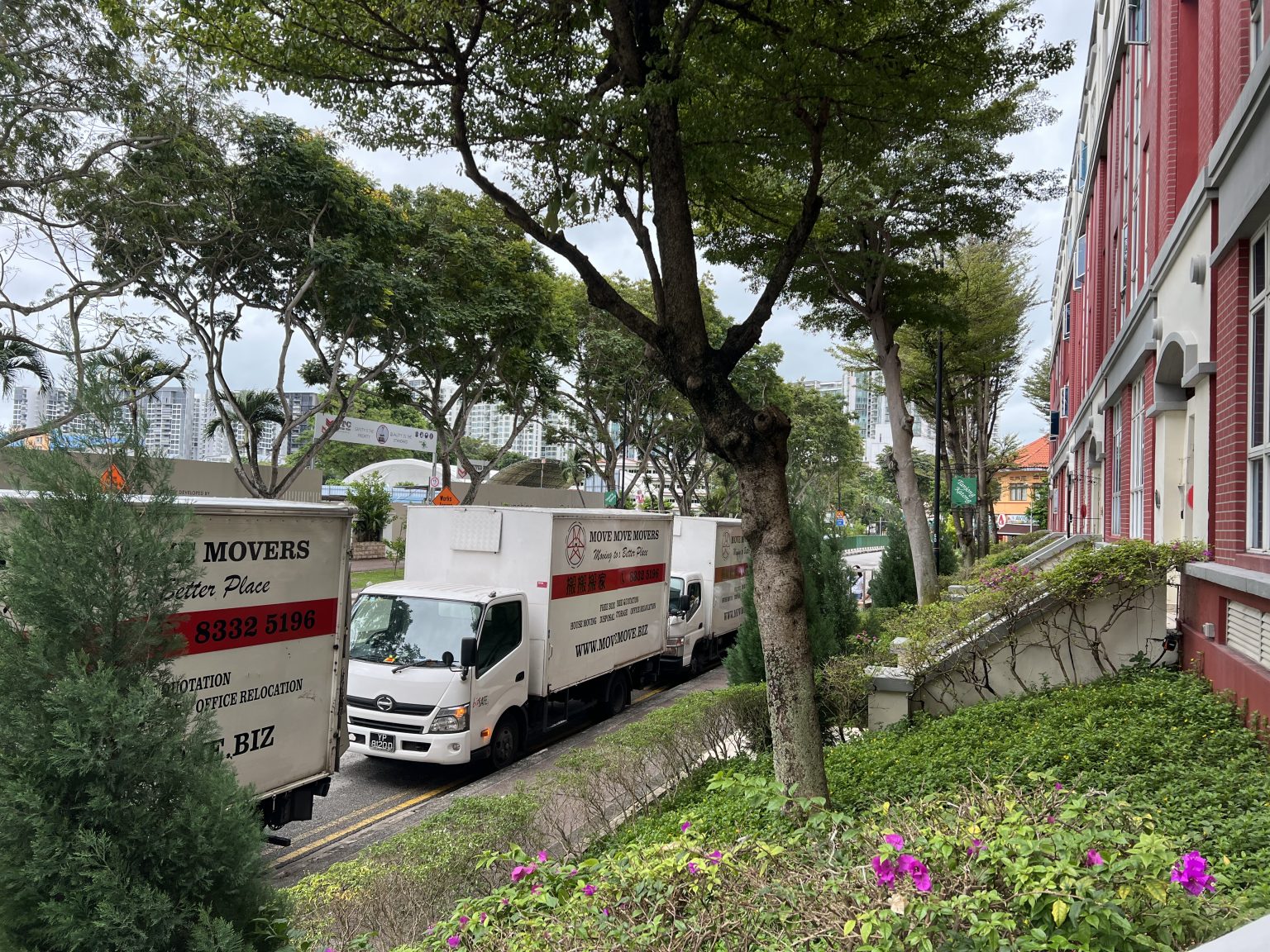 Three branded Move Move Movers lorries parked at a Singapore property