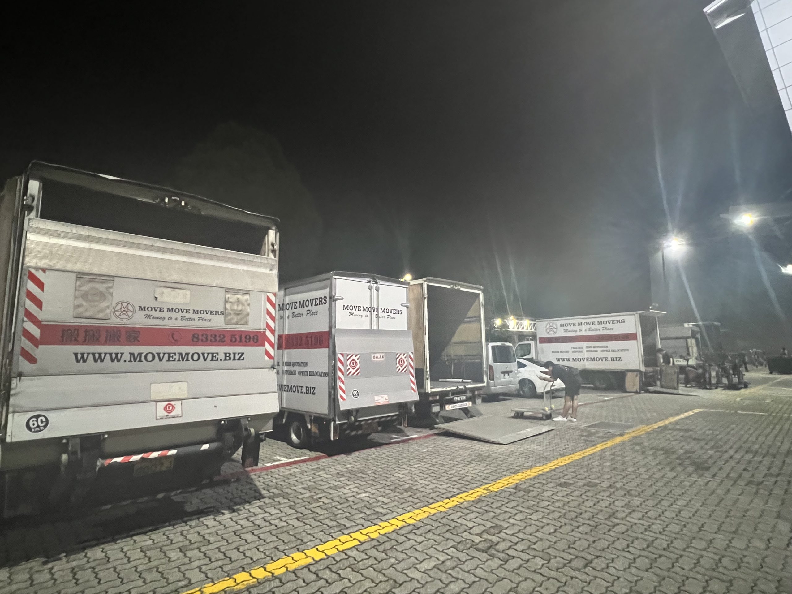 After-hours commercial loading operation at a Singapore site