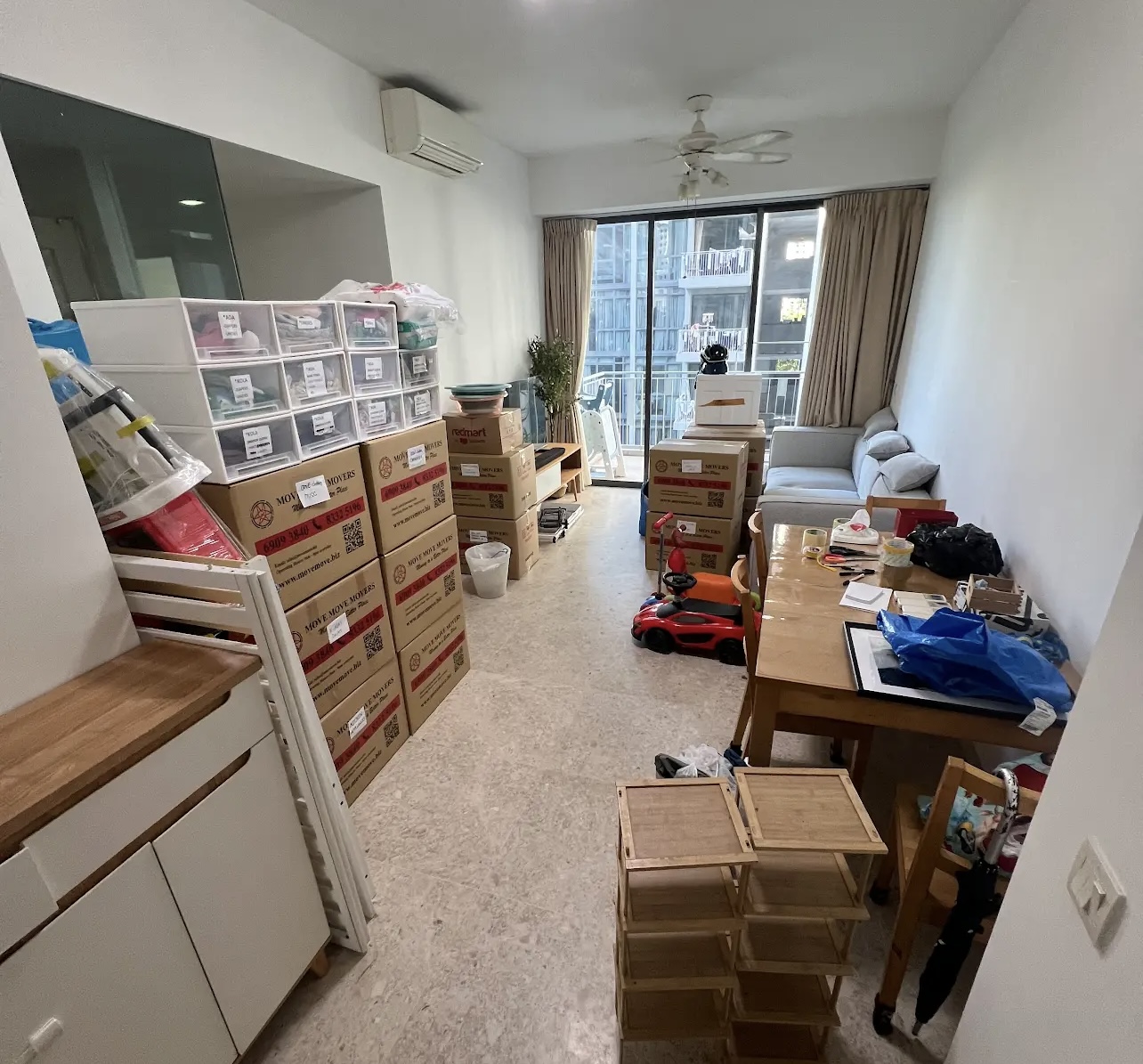 Packed living room during full-house clearance planning in Singapore