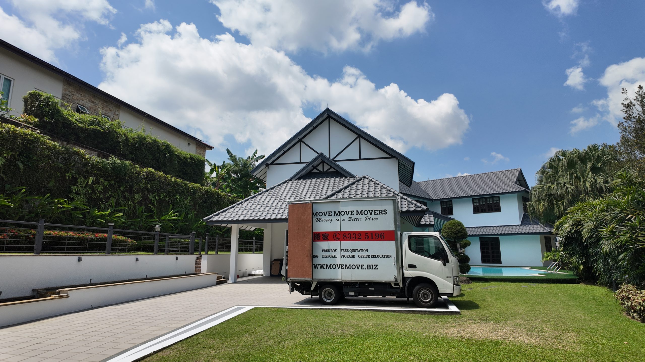 Move Move Movers truck parked outside a landed home before a wider home-clearance job in Singapore