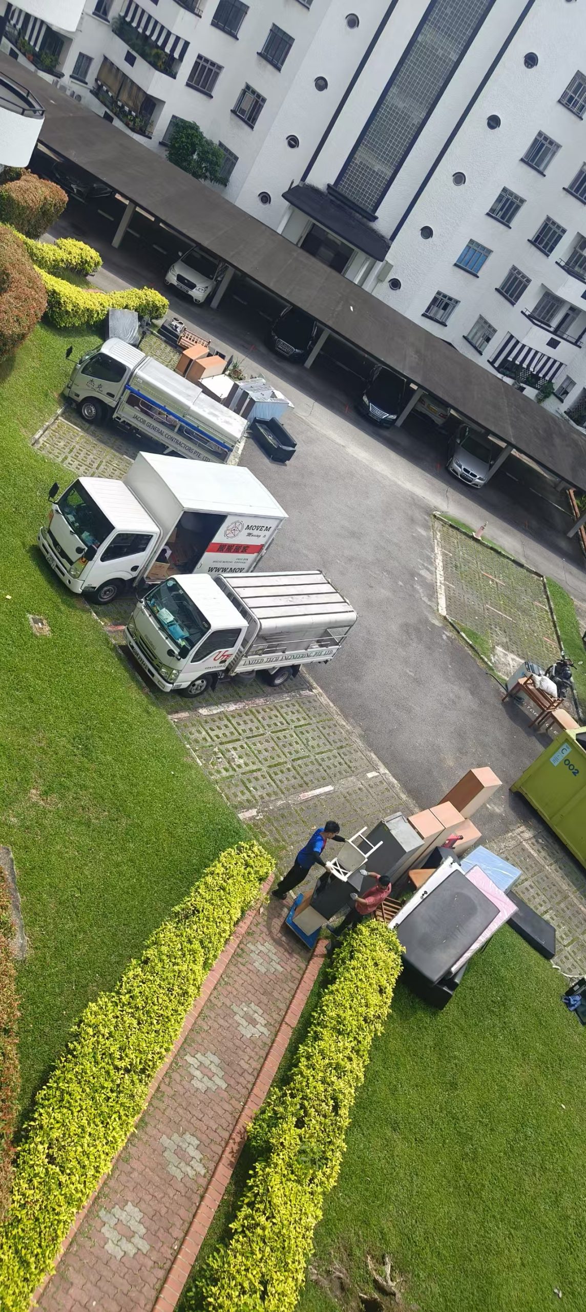 Crew and disposal truck staged for a larger sofa or bulky-furniture removal in Singapore
