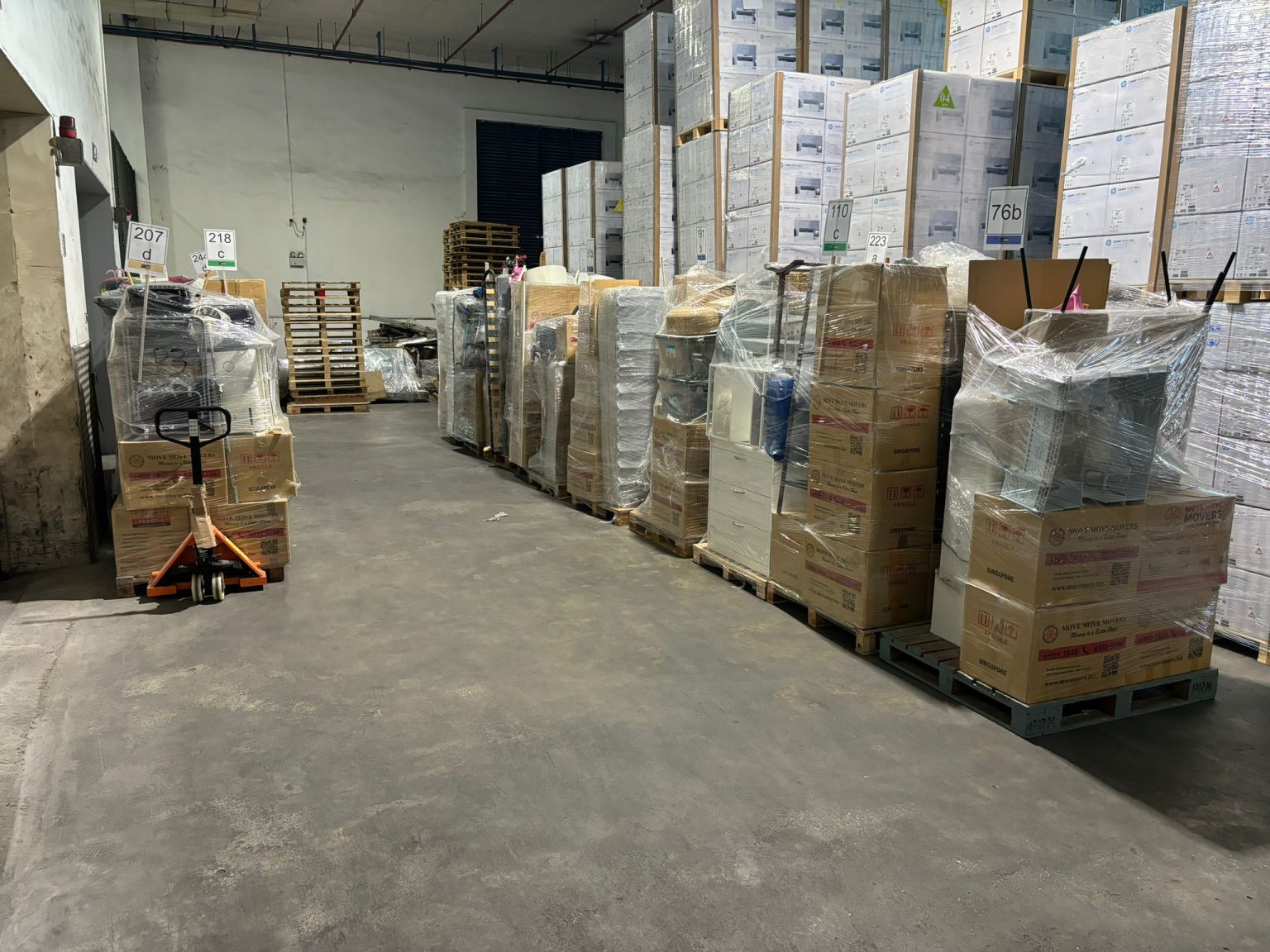 Wrapped and palletised inventory inside a Move Move Movers warehouse