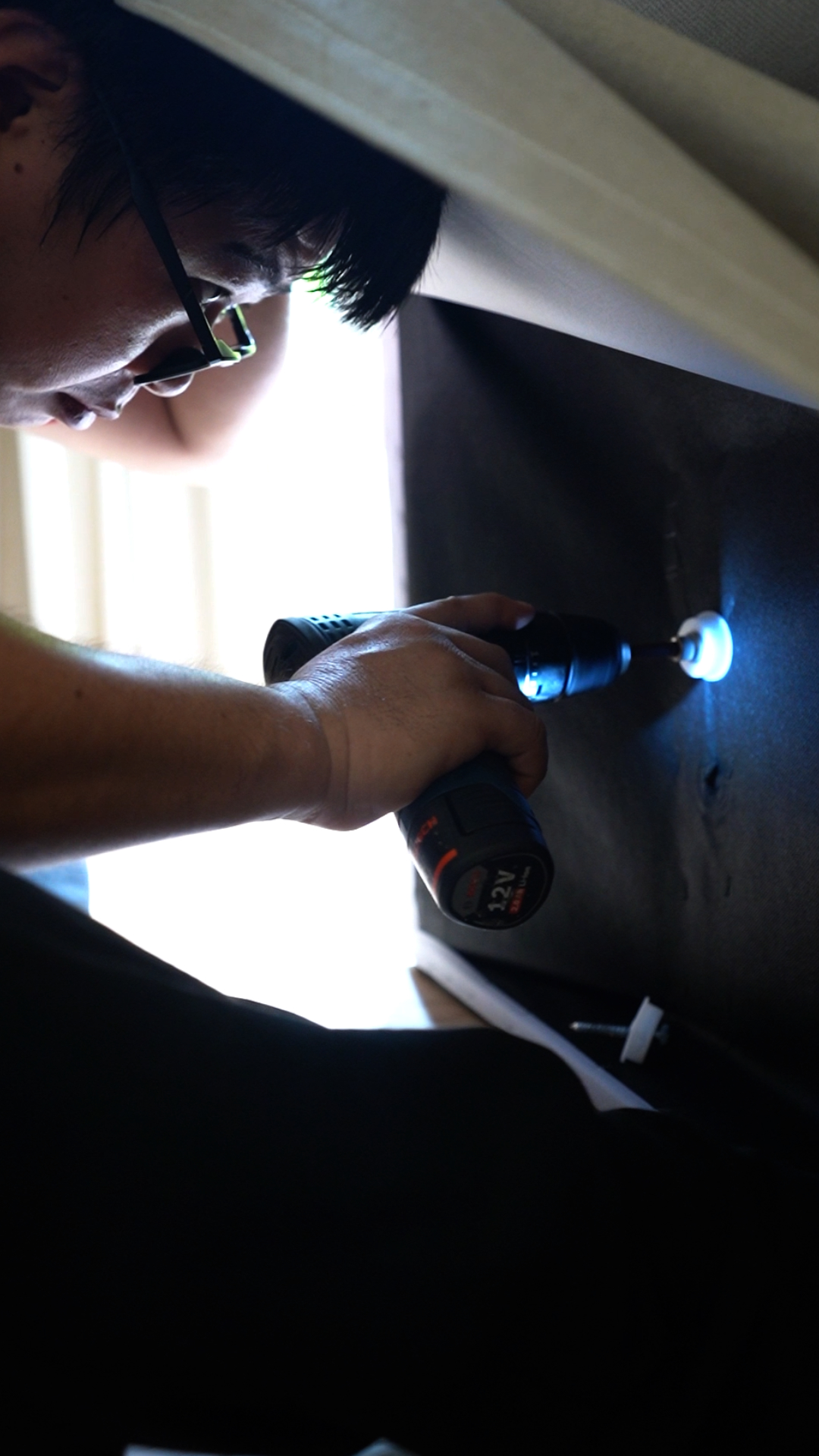 Power-tool dismantling before fitted furniture removal in Singapore