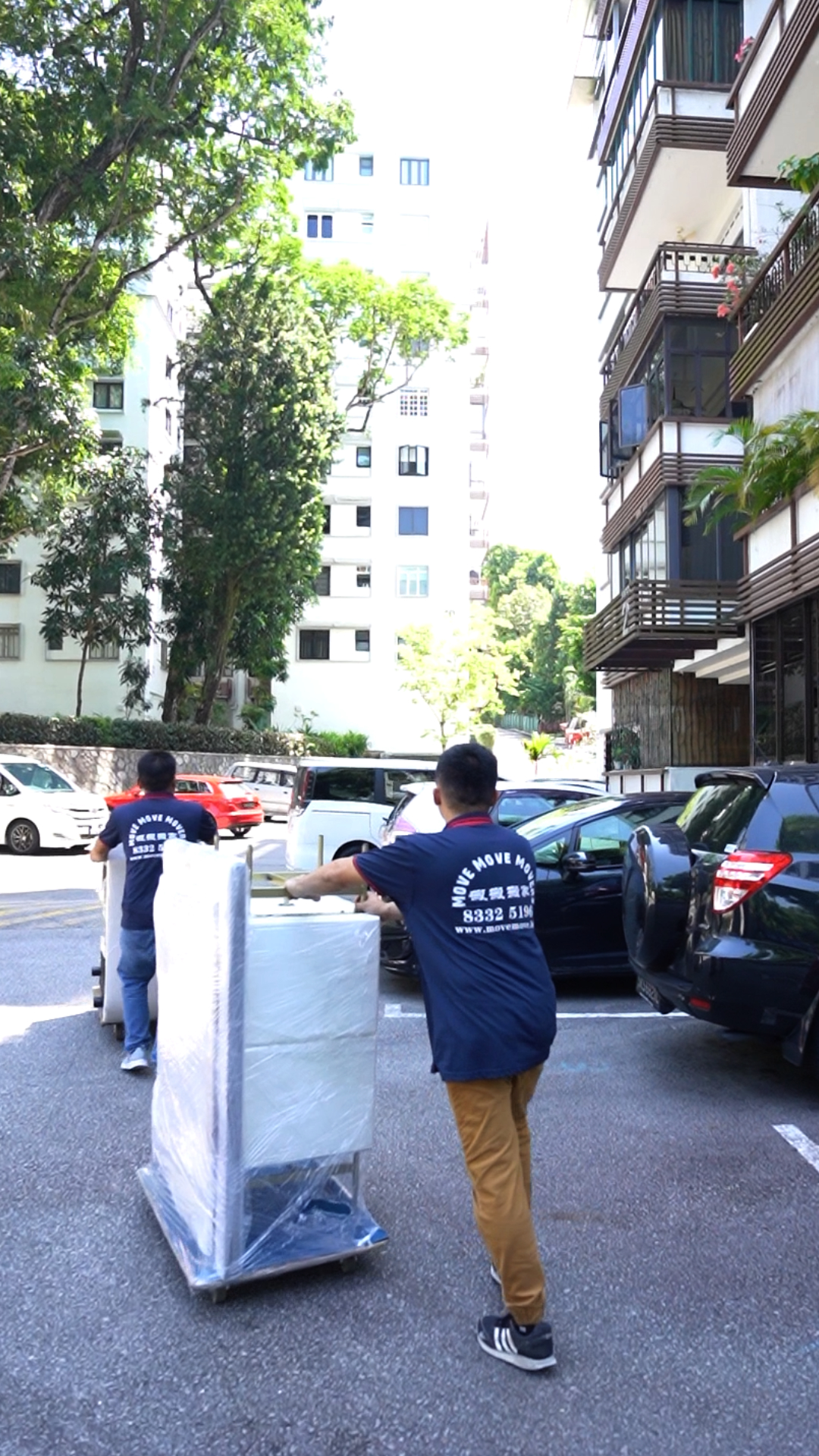 Large appliance being moved on a trolley for private pickup in Singapore
