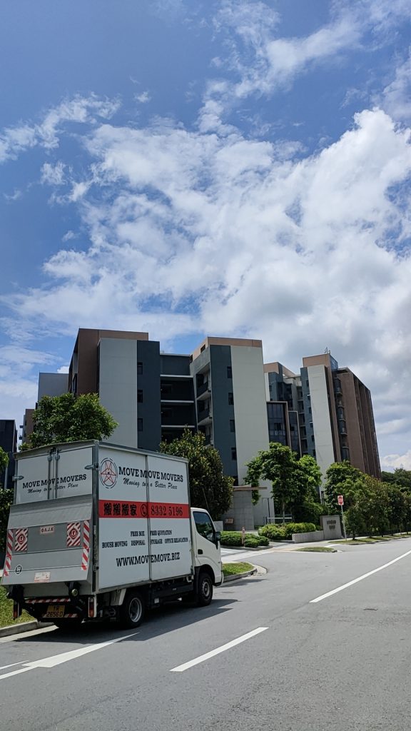 Move Move Movers truck parked outside a Singapore residential development