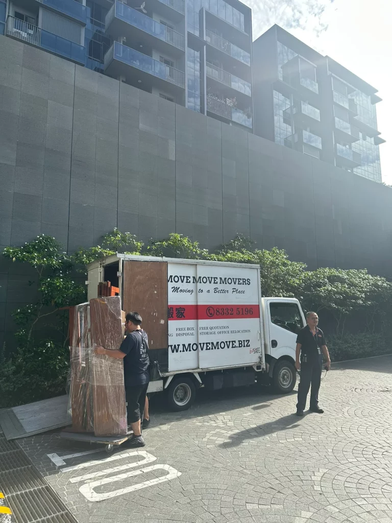 Move Move Movers lorry unloading wrapped furniture outside a condominium in Singapore