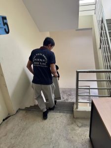 Cabinet and furniture pieces being loaded for disposal in Singapore