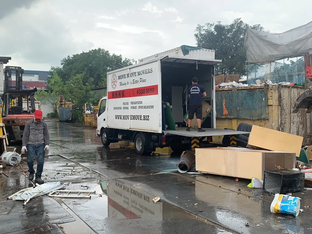 Move Move Movers lorry and crew at a disposal handling site in Singapore